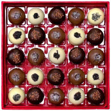 Caramel chocolate assortment tray with dark and cream truffles in red box