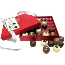 Caramel chocolate gift box with red tray and mixed dark and cream truffles