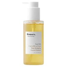 Knours 2-in-1 oil-to-foam facial cleanser bottle with pump, honey-gold liquid