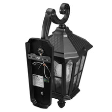 Outdoor wall lantern with hinged mounting arm and clear glass panels, black finish