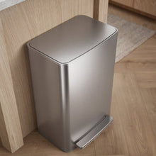 Kohler 45L stainless steel trash can viewed from above, showing its closed lid and foot pedal