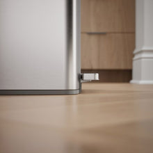 Kohler 45L stainless steel trash can with side view of the foot pedal