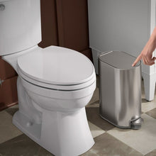 Stainless steel step trash can with open lid and visible foot pedal