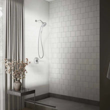 Chrome handheld shower with flexible hose and round spray head