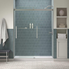Kohler Tellin framed glass shower door with metal handle and side hinges