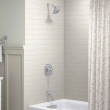 Wall-mounted shower valve trim and rain showerhead over bathtub