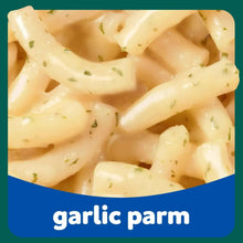 Garlic parm flavored mac and cheese, creamy pasta with small herb flecks