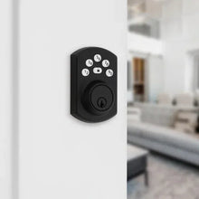 Matte black electronic keypad deadbolt lock mounted on a door with number keypad.