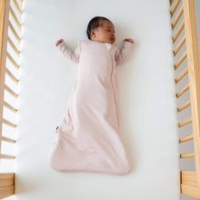 Kyte BABY sleep sack in blush pink on baby, sleeveless with zip front