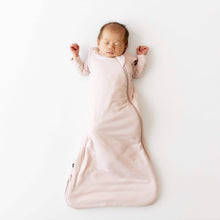 Kyte BABY sleep sack in blush pink on baby, sleeveless with zip front