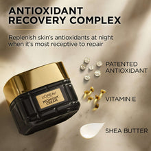 Midnight cream jar with gold lid on light surface, with small cream dollops