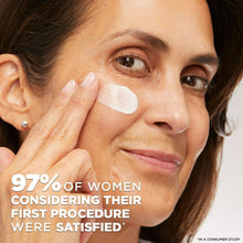 Face moisturizer application on woman's cheek with white cream