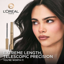 Telescopic mascara and applicator with gold tube beside eye close-up