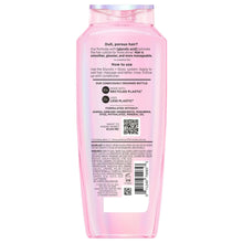 Pink L'Oreal Elvive shine boosting shampoo bottle, back label with ingredient info