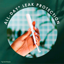 Unscented organic cotton tampon with applicator held in hand, leak protection