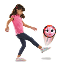 Ladybug character soccer ball toy, pink and red with black spots and big smiling eyes.