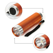 Orange LED flashlight with textured aluminum body, silver rim, and wrist strap