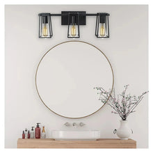 3-light LED vanity fixture on black wall plate, clear glass lantern bulbs