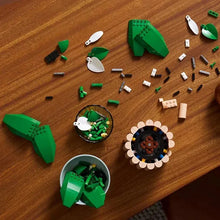 Peace lily flower decor building parts scattered, green leaves and white flower pieces