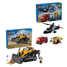 LEGO City vehicle playset with helicopter and bulldozer models beside boxes