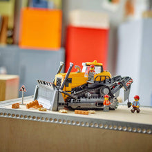 LEGO City construction bulldozer with gray dump bed, yellow boom, and tracks