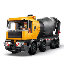 Cement mixer truck building toy with yellow cab and gray mixer drum