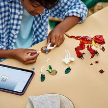 Kids assembling LEGO 3-in-1 dinosaur toy; red model and white parts on desk