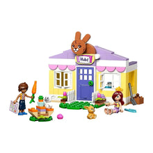 LEGO Friends Bunny Hotel toy house with pink awnings and 'Hotel' bunny topper