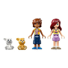 LEGO Friends minifigures with bunny and white animal figures and toys