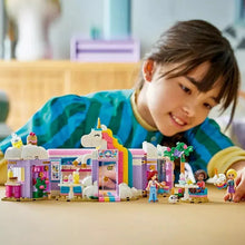 Child and unicorn café building set with minifigures on table