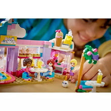 Close-up of unicorn café building set with figures and drink pieces