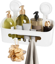 White suction cup shower organizer caddy with cutout shelf, holding soap bottles and towel