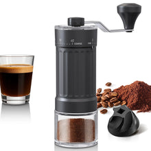 Black hand coffee grinder with adjustable grind dial, glass grounds container and crank