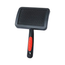 Black slicker grooming brush with rectangular bristle pad and red handle grip
