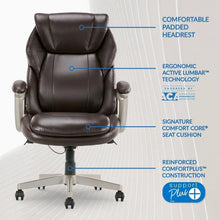 Dark executive chair back and seat with padded arms and chrome base on casters.