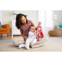 Infant clip-on plush doll toy with smiling face, pink hood, and colorful skirt