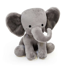 Gray plush elephant toy sitting, with large floppy ears and stitched eyes.