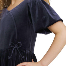 Girls velour dress close-up in dark navy, gathered waist and bow detail at skirt