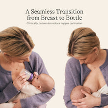 Lansinoh anti-colic baby feeding bottle with purple cap, shown during bottle feeding