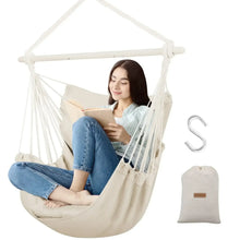 Beige hammock chair swing with white ropes, metal support bar, and two seat cushions