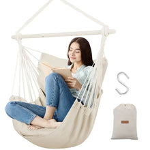 Beige hammock chair swing with seat cushion, hanging rope frame, and storage bag