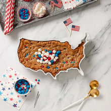 White porcelain U.S. map platter with baked dessert topped with blue-red sprinkles.