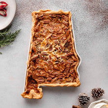 State-shaped bake and serve dish filled with baked casserole and browned topping