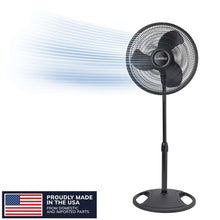 Black pedestal fan with round grille and wide base, shown on a package