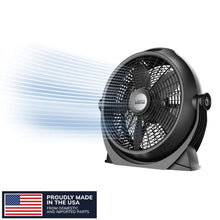 Black floor fan shown from the side with front grille and angled pivot housing