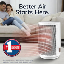 White personal ceramic space heater with cylindrical mesh grille, angled view with airflow vents