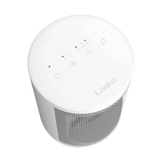 White ceramic space heater with round top control panel and indicator icons, close-up