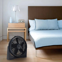 Air circulator floor fan with front grille and black housing