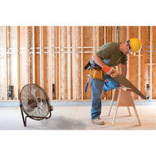 High-velocity floor fan with round wire grille, dark frame, and tilt back head