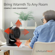 Black ceramic space heater on table with angled fan grille